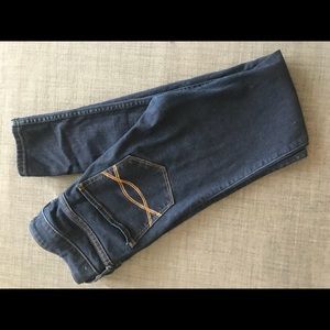 Dark wash super skinny jeans.